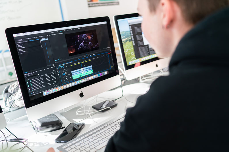 Student editing video on Premier Pro